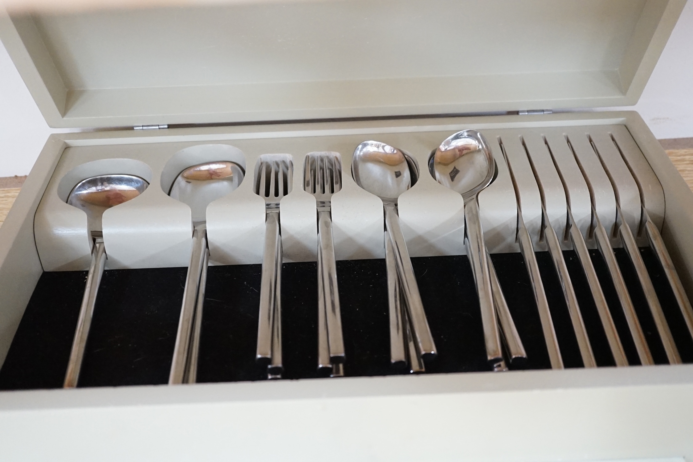A contemporary 'Inspiration' stainless steel canteen of cutlery, 44cm wide. Condition - fair, not complete